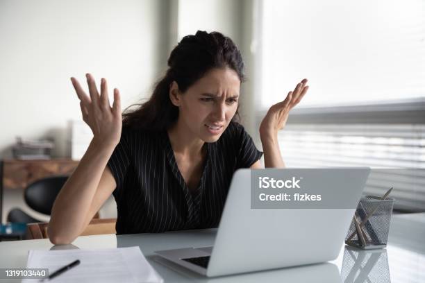 upwork scams - picture of a distraught woman scammed online
